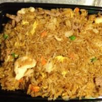 House Fried Rice · Stir-fried rice with onions, eggs, peas, carrots, shrimp, chicken and beef.