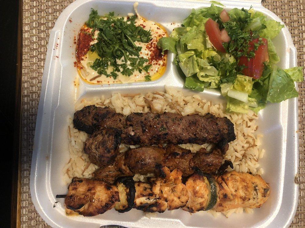 Combination Plate · 3 skewers of chicken, filet minion and khash khash kebab. Served with rice, hummus, salad and pita.
