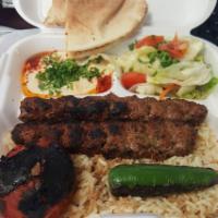 Khash Khash Kebab · 2 Skewers. Grilled ground beef marinated with spices, onions and parsley. Served with rice, ...