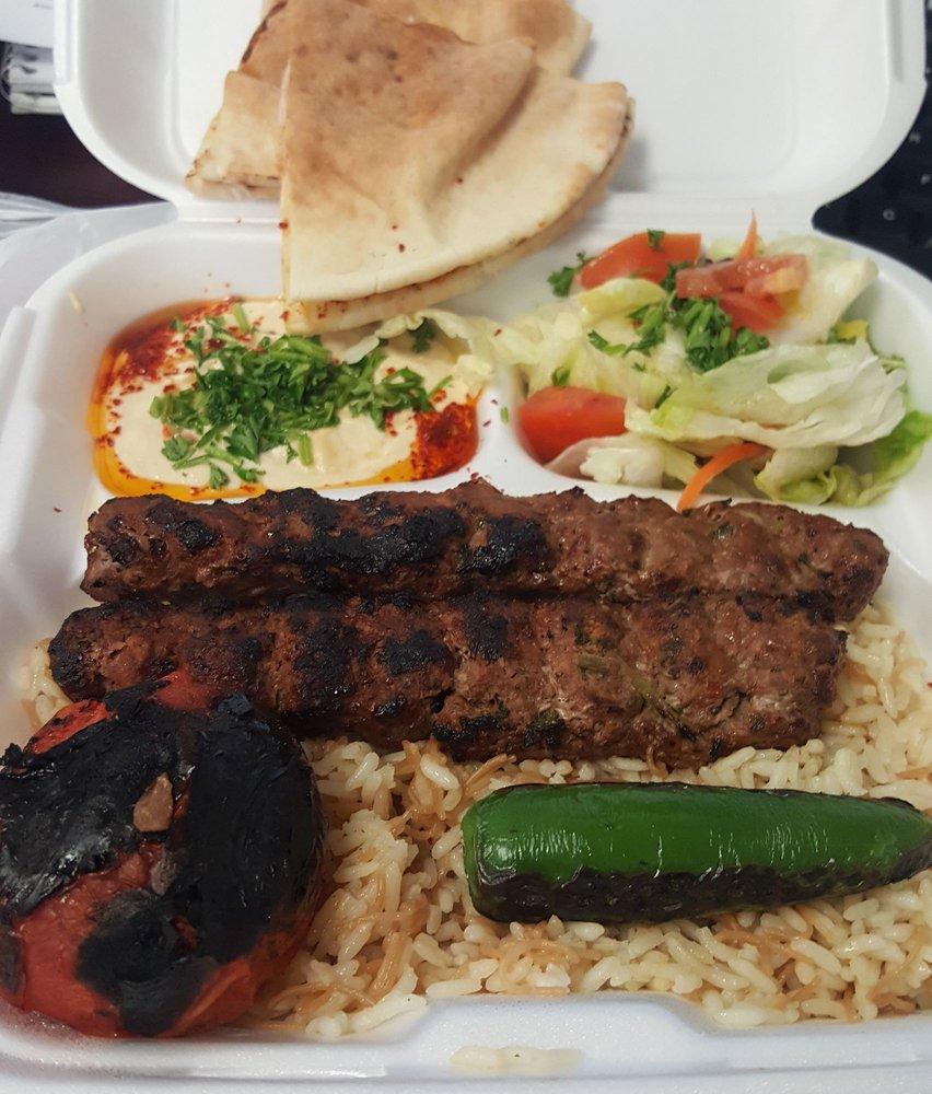 Khash Khash Kebab · 2 Skewers. Grilled ground beef marinated with spices, onions and parsley. Served with rice, hummus, salad and pita.