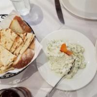 Tzatziki · A refreshing dip w/ shredded cucumbers, raw garlic, yogurt & a hint of dill