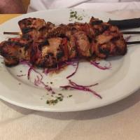 Pork Souvlaki · Marinated pork kebab w/ apples & dried figs & topped w/ olive oil