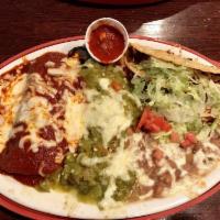 Tuesday Atrisco Plate · A relleno with green chile, a blue corn chicken enchilada with red chile, and a beef taco se...