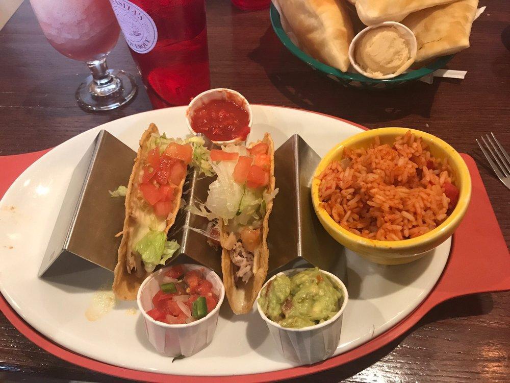 Tacos · Your choice of ground beef, chicken, or refried beans. Served in a hard shell with cheese and garnish on the side.