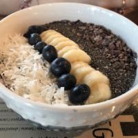 Raw Fresh Super Acai Bowl · Blueberries, bananas, topped with chia seeds, nuts, cacao nibs, coconut and berries.
