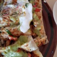 Asada Quesadilla · Includes: Rice, Beans, guacamole and sour cream on the side
