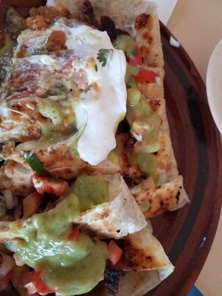 Asada Quesadilla · Includes: Rice, Beans, guacamole and sour cream on the side