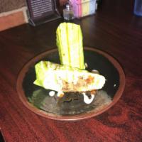 Surf And Turf · Surf and turf. Crabmeat, tempura shrimp and avocado topped with smoked brisket, finished wit...