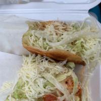 Hard Shell Taco · corn tortillas stuffed w your choice of protein, Topped with lettuce cheese and tomato