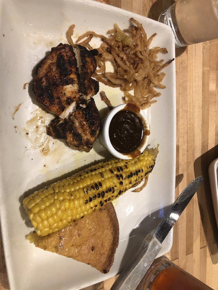 BBQ Chicken Breast · Cooked over an open wood fire. All-natural, hormone-free, fresh chicken breast basted in PS original or sweet BBQ sauce served over crispy onions strings. Served with grilled corn on the cob and your choice of one signature side.