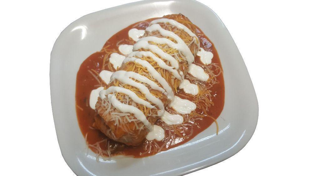 Wet Burrito · Rice, beans, onions, cilantro, salsa, and choice of meat wrapped in a flour tortilla and covered in rancher salsa, melted cheese and sour cream.