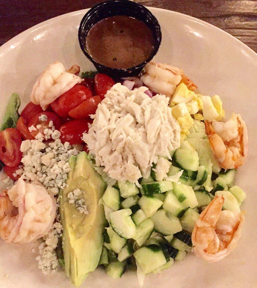 Shrimp and Crab Cobb Salad · Mixed greens with shrimp and crab, tomato, red onion, cucumbers, bleu cheese crumbles, bacon, egg, diced avocado with Louie dressing.
