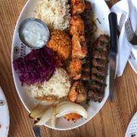 Chicken Kebab · Cubes of marinated chicken breast char-broiled on skewers. Served with rice and burgol.