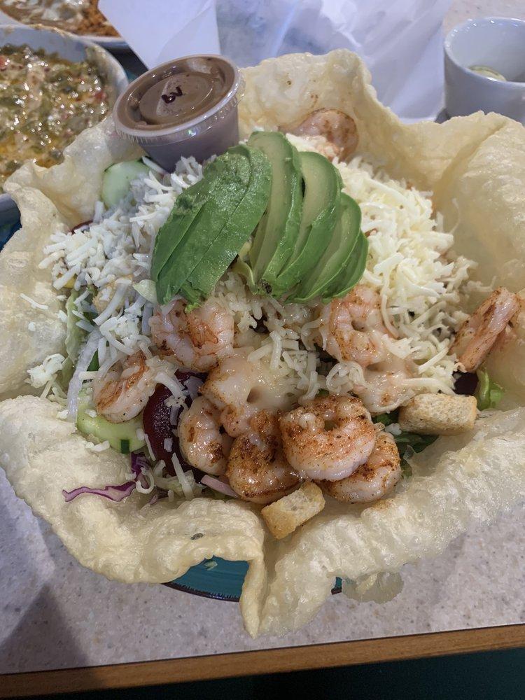 Shrimp and Avocado Salad · A giant, crisp flour tortilla bowl filled with lettuce and topped
with shrimp, avocado wedges, tomatoes, onions, bell peppers, and
cheese.