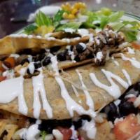 Quesadilla · Flour totillas, Mexican sausage, quesillo, rice, beans and any choice of meat.