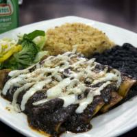 Enchiladas · Four rolled tortillas with green or red sauce, rice, beans and choice of meat.