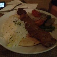 Persian Chicken Kabob Platter · With basmati rice, grilled onion, tomato, peppers, and buttered pita.