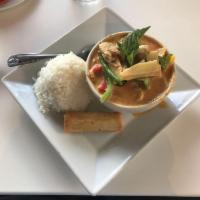 Duck Red Curry · Crispy roasted duck topped with red curry, bamboo shoot, bell peppers, pineapple, tomatoes, ...