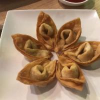 Golden Wontons · Homemade wontons. Non-GMO soy protein, celery, leek, green onion, and sesame oil hand wrap i...