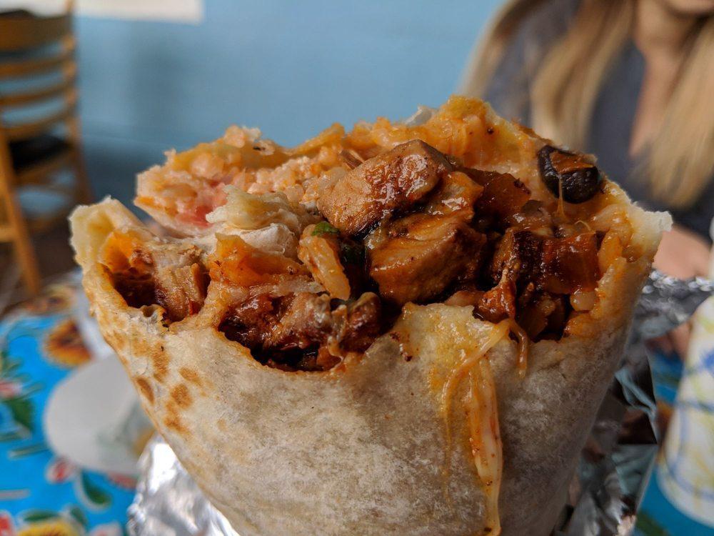 Super Burrito · Super burrito comes with rice, beans, pico de Gallo, with guacamole, sour cream, cheese and meat.