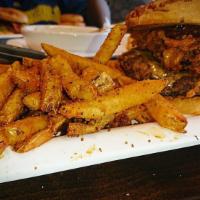 Wild Boar Burger · Tillamook cheddar, coleslaw, crispy onion straws, BOB sauce, blazing onion BBQ sauce, and on...