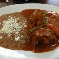 Amarillo · Mole made from corn masa, herbs and spices and served over chicken. Servido con arroz y frij...