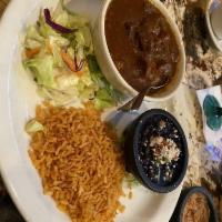 Chile Colorado · Chunks of beef cooked in a New Mexico red chile sauce, served with your choice of corn or fl...