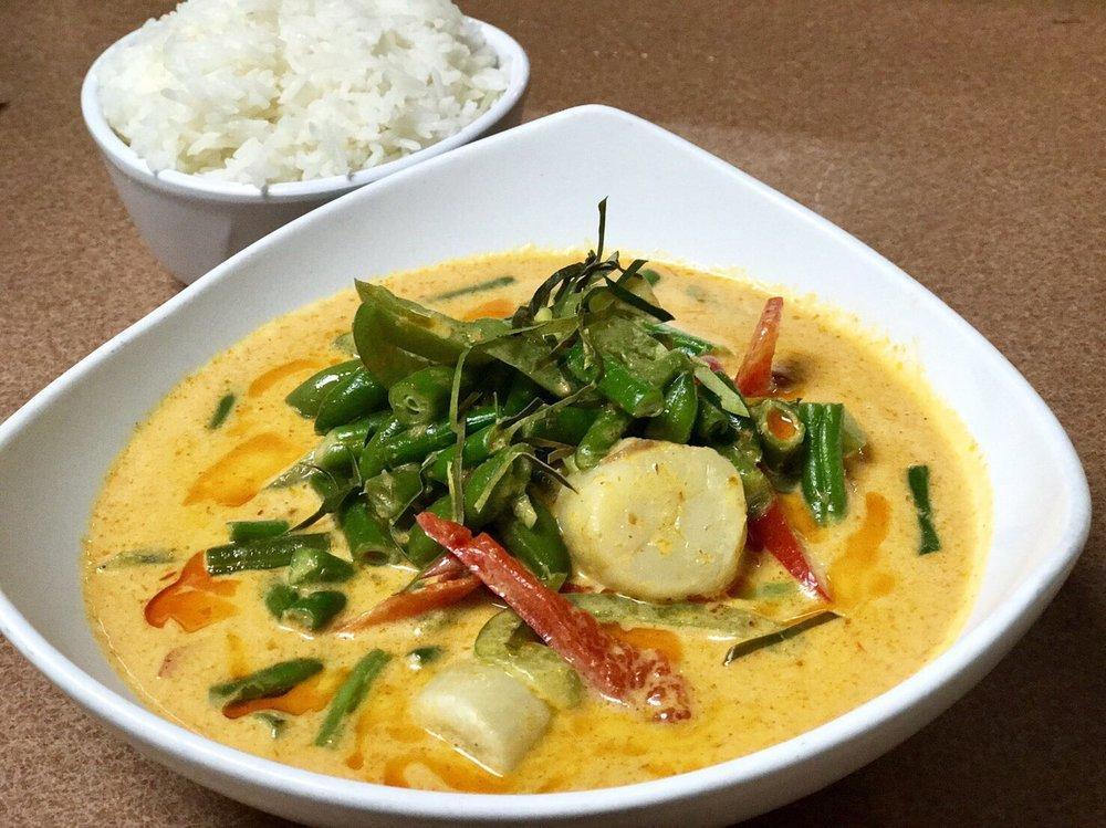Panang Curry · Panang curry paste curry paste, coconut milk, kaffir lime leaves, bell peppers, peas, carrot, and peanut sauce.