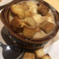 Crock of Creamy French Onion Soup · Comes with melted Swiss cheese.