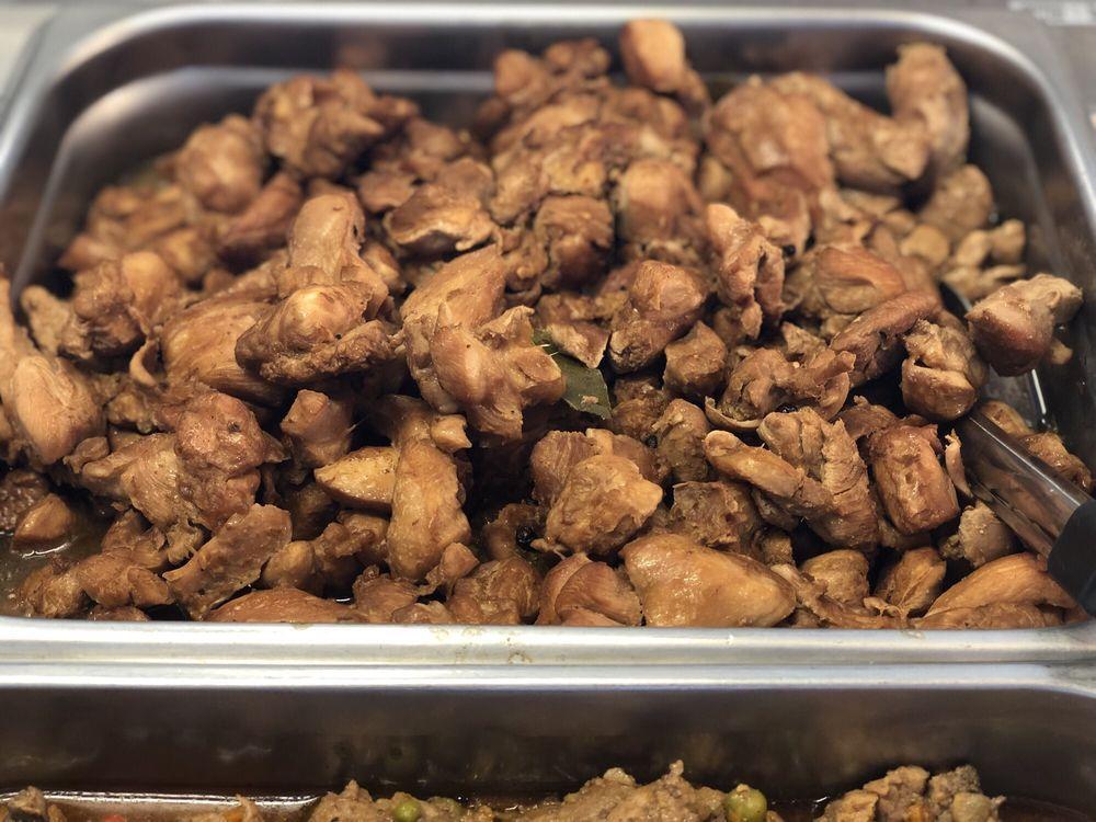 Chicken Adobo · Chicken braised  in a sauce made up of vinegar, soy sauce, garlic, and black pepper. It’s tangy, salty, garlicy, slightly sweet, and spicy. 