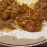 Chicken Curry · Boneless pieces of chicken cooked in a well-balanced blend of house spices.