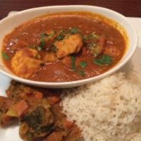 Chicken Vindaloo · Chicken cooked with potatoes, ginger, garlic & special spices. Served with Basmati rice .