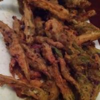 Bhindi Kurkuri · Crisp fried fine cut okra with diced red onions, tomatoes, cilantro, and chili.