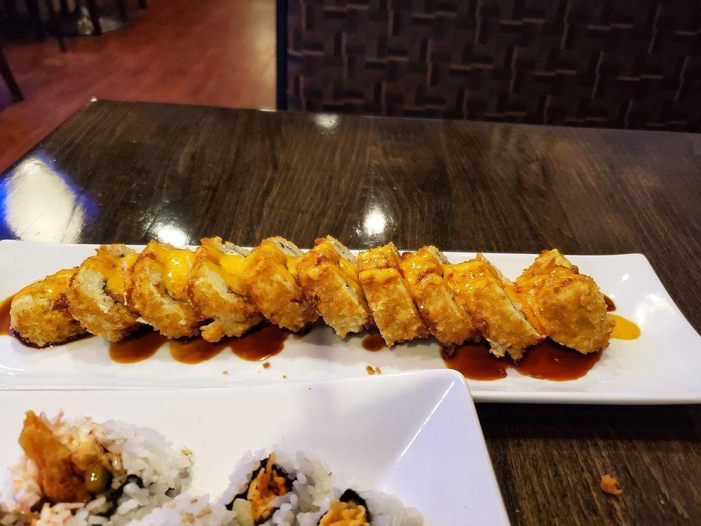 Las Vegas Roll · Smoked salmon, avocado, cream cheese, and crispy Japanese bread crumb with eel sauce and spicy mayo.