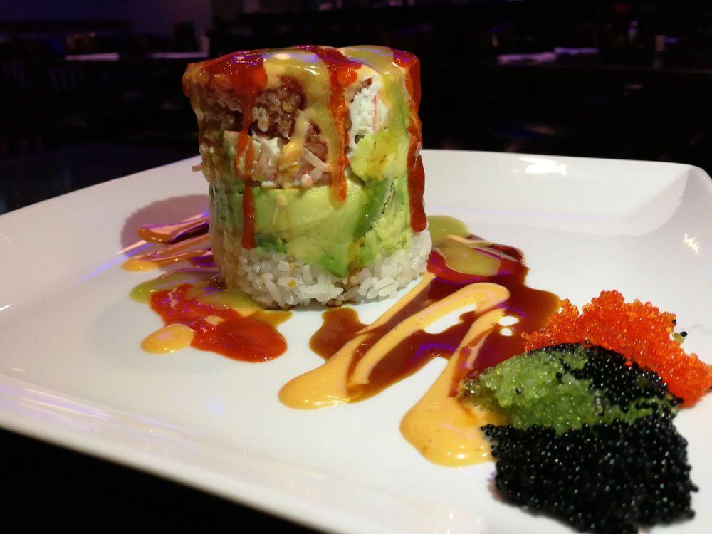 Ahi Tower Roll · 4 layered tower made of spicy tuna, avocado, crab meat, and sushi rice with 3 kind of caviar and 4 kind of special sauce.