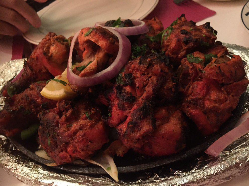 Tandoori Chicken · Chicken on the bone, marinated overnight in clay tandoor oven. Served with aromatic basmati rice.