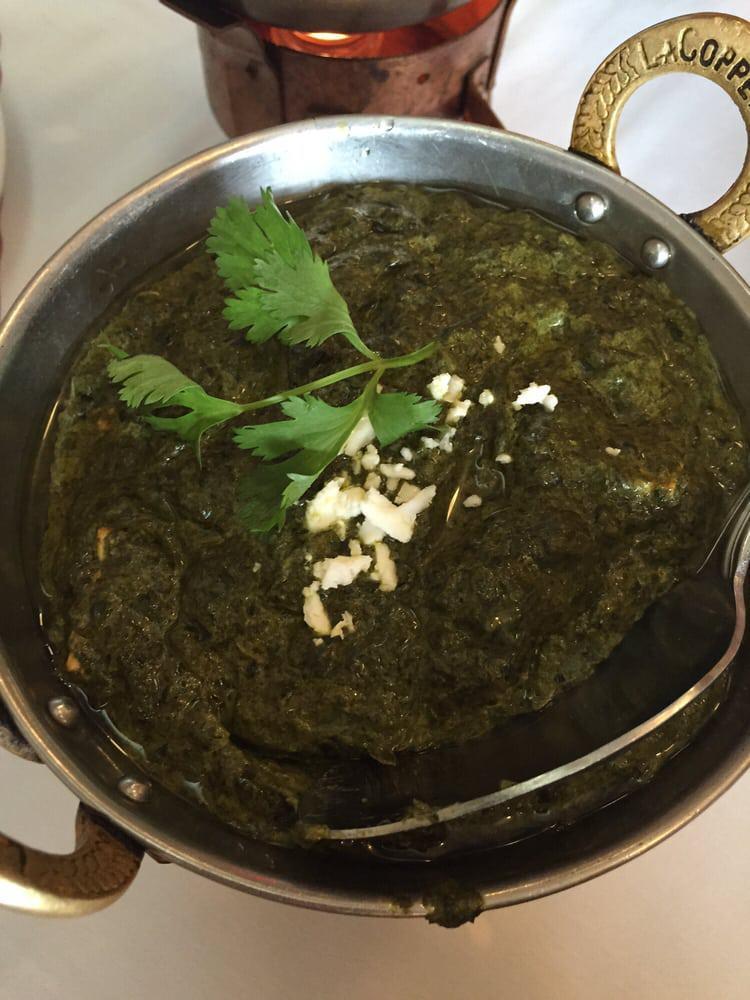 Saag Paneer · Fresh farmers cheese cooked in a flavorful spinach curry. Served with aromatic basmati rice.