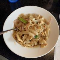 Drunken Noodles · Stir-fried flat rice noodles with basil, red onion, scallion and bean sprouts. Hot and spicy. 