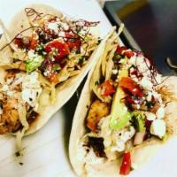 2 Chicken Street Tacos · Marinated chicken, cilantro lime aioli, cabbage, queso fresco, avocado, pico de gallo .