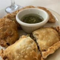 Empanadas · Homemade empanadas straight from Riven Plate containing ham, cheese, meat, and hash,chicken,...