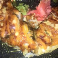 Maryland Roll · Inside: crab meat, avocado, and cream cheese. Top: deep-fried tempura with eel sauce and spi...
