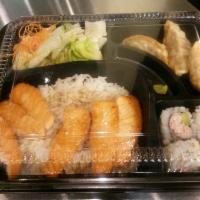 Salmon Bento Box · Served with garden salad, 4 pieces California roll, 3 pieces dumplings, choices of steamed r...