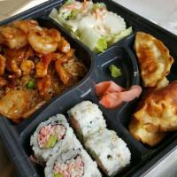 Shrimp Bento Box · Served with garden salad, 4 pieces California roll, 3 pieces dumplings, choices of steamed r...