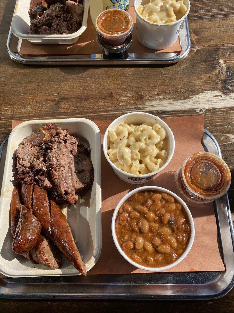 Brisket · Slow-smoked for 22 hours before being hand-carved. Served with an optional assortment of pickled veggies and slaw.