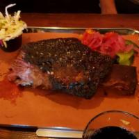 Brontosaurus Rib · On-the-bone, slow-smoked Short Rib with almost a full pound of meat on the rib. Served with ...