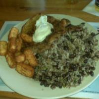 Gallo Pinto · White rice and black beans mixed, served with sweet plantains, fried egg, fried cheese cube,...