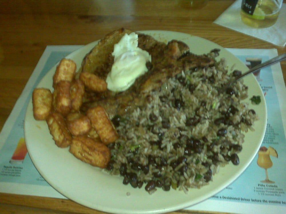 Gallo Pinto · White rice and black beans mixed, served with sweet plantains, fried egg, fried cheese cube, and sour cream. 