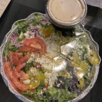 Greek Salad · Lettuce, tomatoes, onions, black olive, pepperoncini, bell peppers and feta cheese.