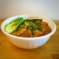 Vegan Noodle Soup · Fried Tofu and Bok Choy served with noodles in aromatic vegetable broth topped with green on...