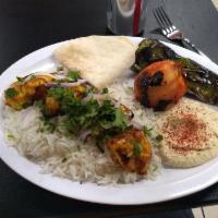 Chicken Kabob Plate · Marinated chicken breast. Served with hummus, grilled green pepper and tomato, choice of ric...